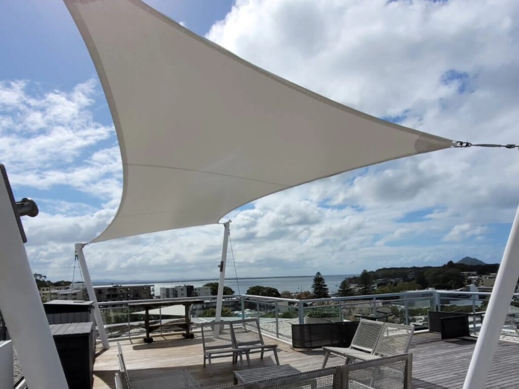 vinyl shade sail over deck area in nelsons bay
